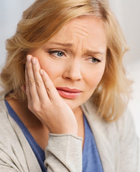 Woman worried about failing dental implant in Alexandria 