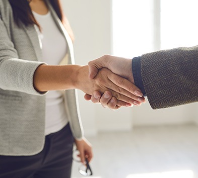 Two professionals shaking hands