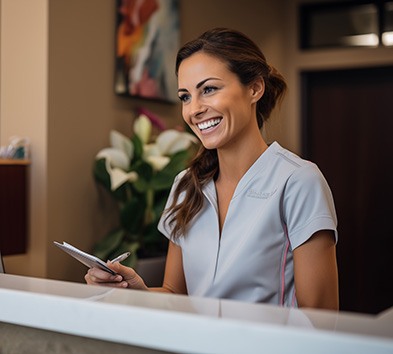 Happy, smiling dental team member