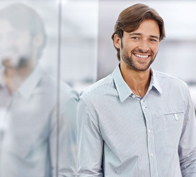 Confident, smiling man in business setting